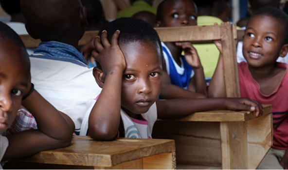 Children sitting at desks in a classroom